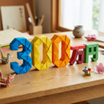Origami paper art forming blue 3, yellow and orange 0s, and red and green Japanese characters